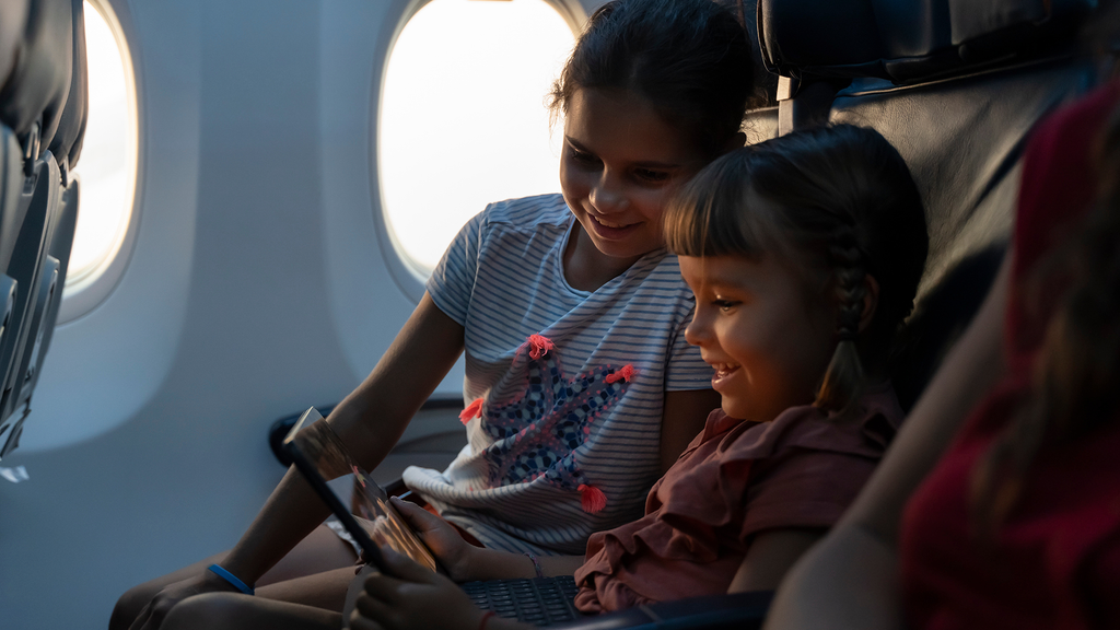 two children in an airplane cabin