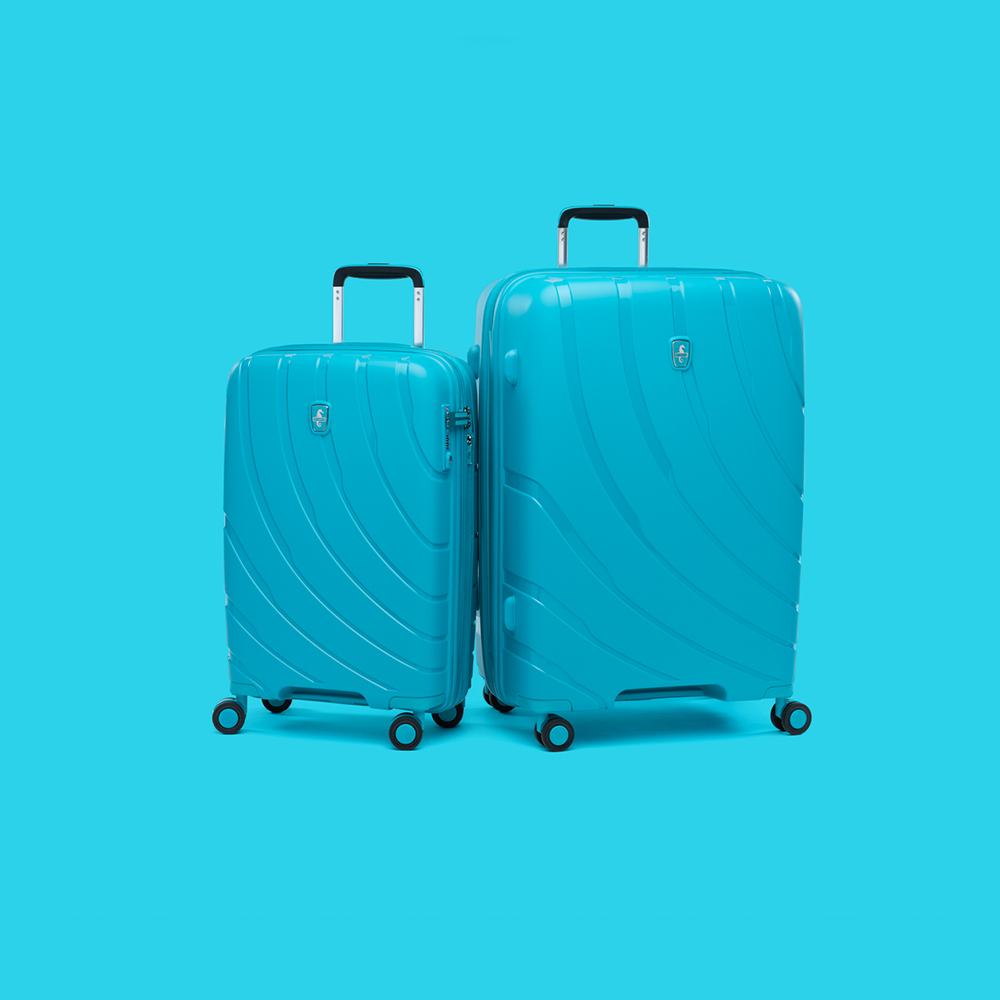 pair of surf teal luggage